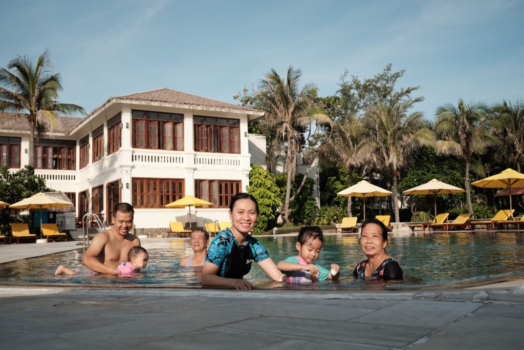Family enjoying a sunny day at a luxury resort pool